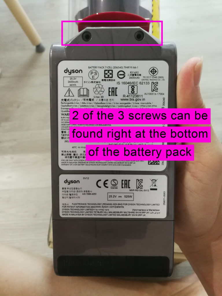 2 of the 3 screws can be found right at the bottom of the battery pack