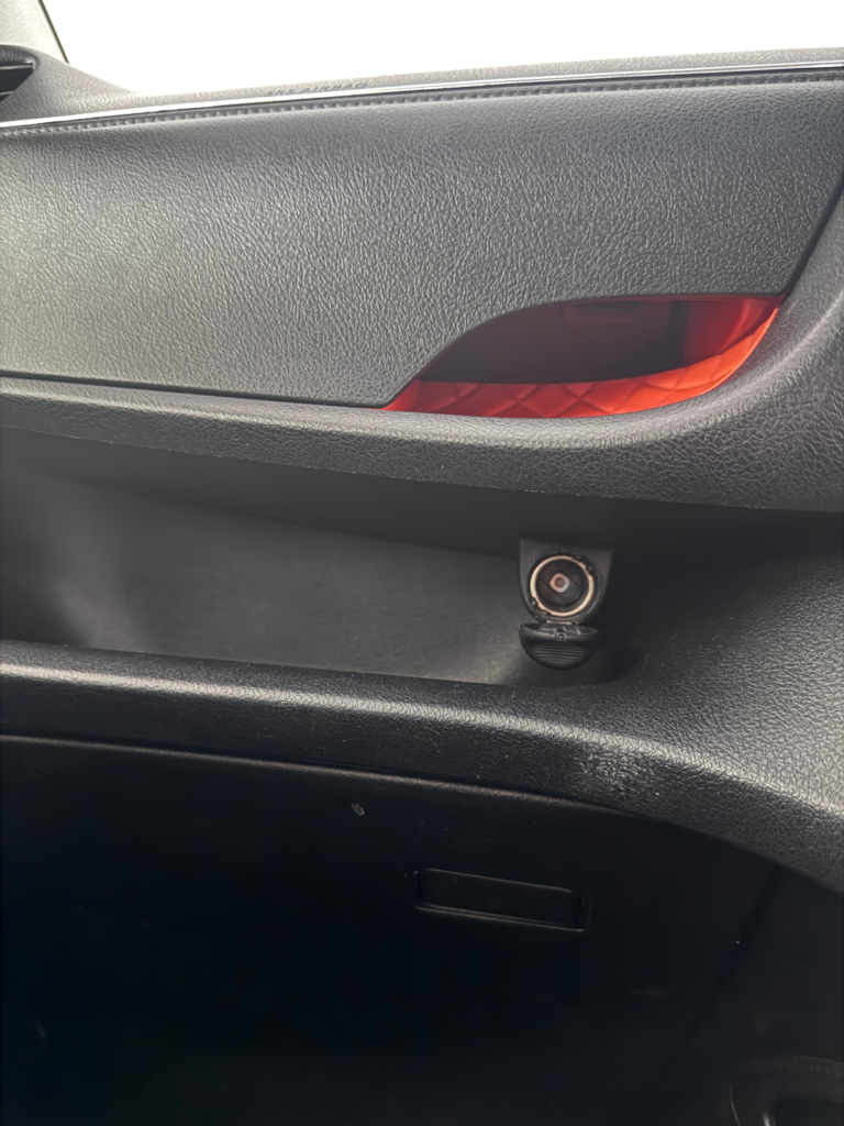 Dashboard storage tray and 12V power socket in a Tribecar Toyota Sienta Hybrid